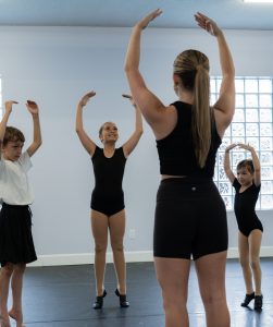 Students following their teacher and practising their balances.